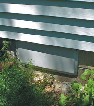 A gray crawl space vent cover in Lake City