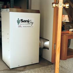 A basement dehumidifier with an ENERGY STAR® rating ducting dry air into a finished area of the basement  in Pittsfield