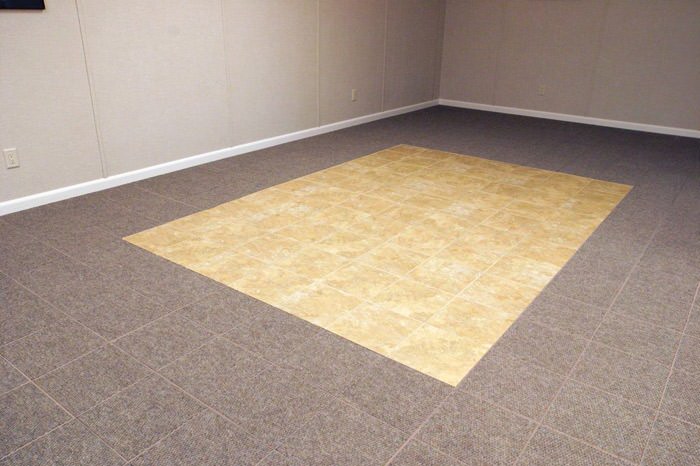 tiled and carpeted basement flooring installed in a Warren home